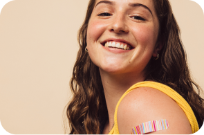 older teen with an adhesive bandage on her arm, indicating she has been vaccinated against meningococcal meningitis